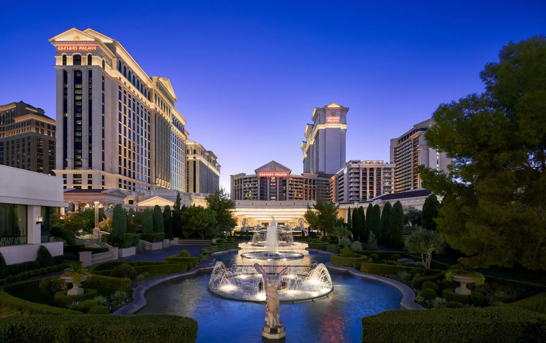 Caesars Palace towers and fountains at blue hour